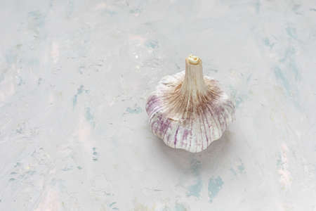 Fresh young whole garlic on light background. Selective focus, copy spaceの写真素材