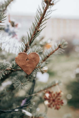 DIY handmade cookie decoration on a Christmas treeの写真素材