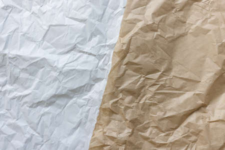 Crumpled brown and white kraft paper for gift wrapping or packaging. Close up, texture background,...