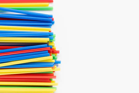 Pack of colorful plastic straws on white background. Recycle, environment conversation, pollution...