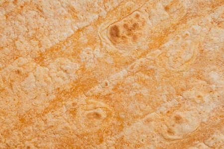 Tomato flavored wheat tortilla wraps. Spanish or Mexican circular unleavened flatbread from wheat...