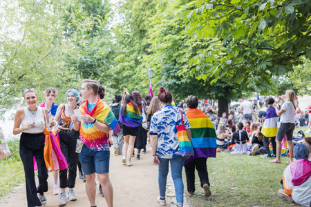 People with rainbow flags at the Pride Village on Strelecky Island at annual Prague Pride festival. Prague, Czech Republic - August 7, 2021のeditorial素材