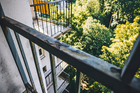 Urban Balcony with Greenery View in Modern Apartment Building.の素材