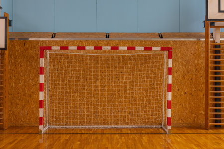 Indoor Soccer Goal in School Gymnasium with Wooden Floor and Equipment.の写真素材