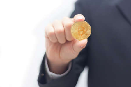 Business man holding Bit coin