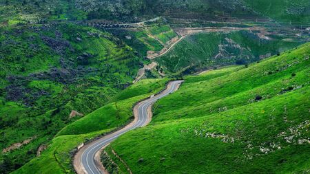 Beautiful road in Israel on the border with Jordan. Beautiful green hills and road. Golan Heights.の写真素材
