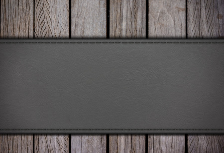 Leatherette on old wood backgroundsの写真素材