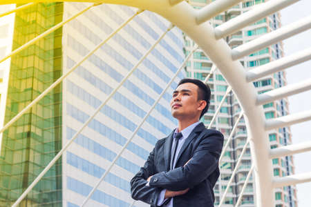 portrait of business man confident with building background in the downtownの写真素材