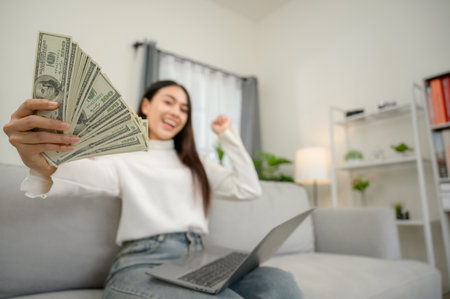 Happy freelancer happy to earn money online earn money from home Successful businessman earning euros from laptop professionally happyの写真素材