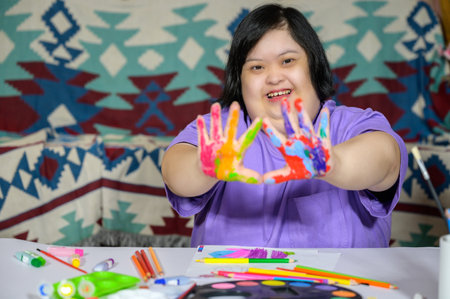 Asian girl with down syndrome watercolor and hand painted Young woman with Down syndrome happy smiling and looking at camera Education concept for children with disabilities.の写真素材