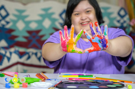 Asian girl with down syndrome watercolor and hand painted Young woman with Down syndrome happy smiling and looking at camera Education concept for children with disabilities.の写真素材