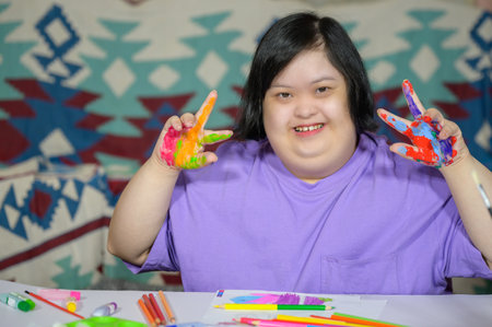 Asian girl with down syndrome watercolor and hand painted Young woman with Down syndrome happy smiling and looking at camera Education concept for children with disabilities.の写真素材