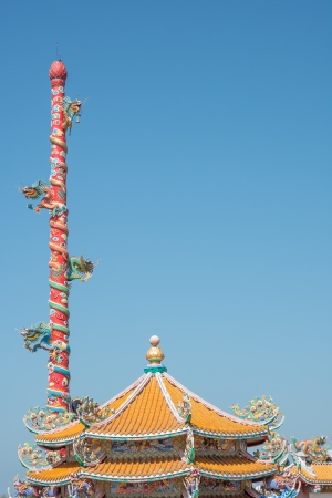 Chinese dragons statue on pillar with blue skyの写真素材