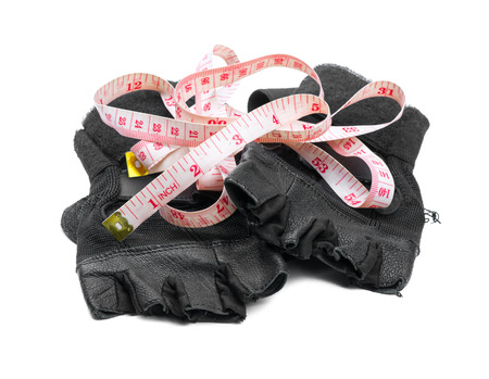 fitness glove and measure tape isolated on white backgroundの写真素材
