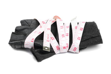 fitness glove and measure tape isolated on white backgroundの写真素材