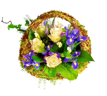 basket of roses, iris dutch xiphium, and veronicaの写真素材