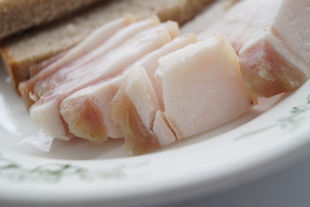 Lard and bread on a plate photo foodの写真素材
