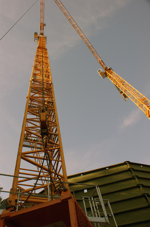 Cranes while demolition of gas tankの写真素材