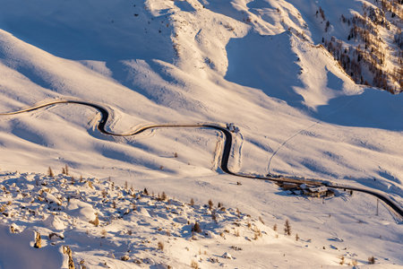 Snowy alpine road in the mountains. beautiful winter landscape in the Dolomitesの写真素材