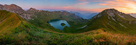 Panoramic view of lake in the mountains at sunset. Beautiful summer landscape.の写真素材