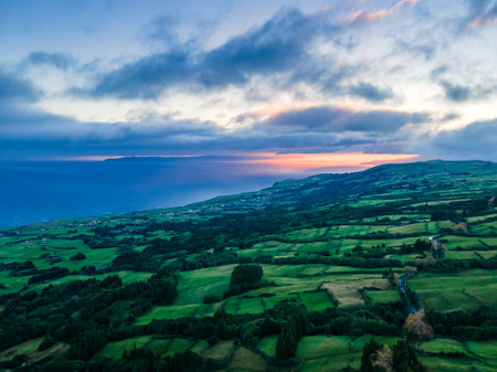 Aerial view of beautiful sunset over the sea with clouds in the skyの写真素材