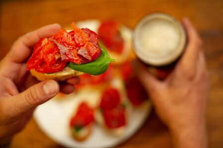 Hearty snack with different kinds of spreads on farmhouse bread served with a fresh yeast wheat beer...