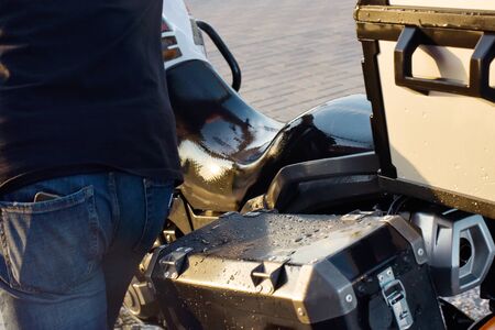 Motorcycle Car Wash Motorcycle Big Bike cleaning with foam injection Make more clean. A series of photos a biker washes his motorcycle at the car wash. Black-white-red color of the bike. Clean vehicleの写真素材