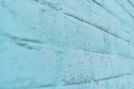 texture: old cracked brick wall painted in paint. Brick wall texture. The old wall of the building....