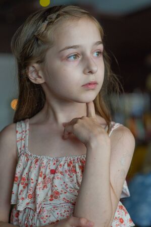Portrait of a 9 years old female child, portrait concept of a child. Close-up face of beautiful girl 8-9 years old.の写真素材