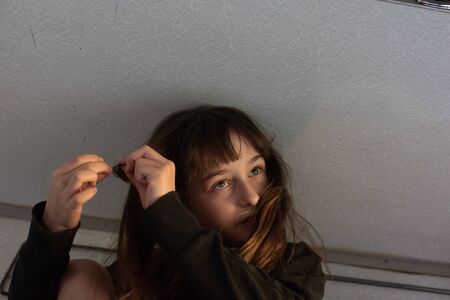 Cute girl lying on the top shelf in the train. Summer Vacation and Travel Concept. the girl in the...