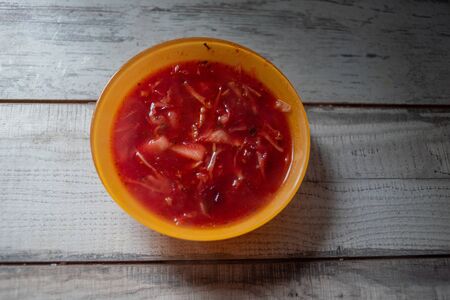 Traditional Ukrainian Russian vegetable borscht on the old wooden background. borscht. borsch with...