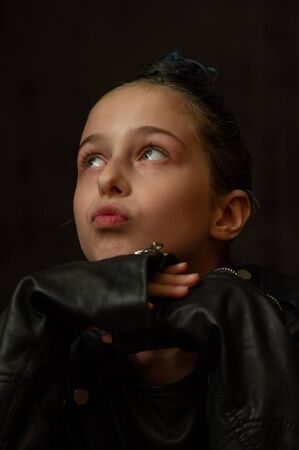 Portrait of nine year old girl. Teenager with blue strands on her hair. A series of photos of a girl...