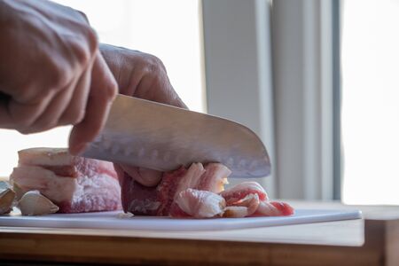 Garlic and bacon.Bacon and garlic. Bacon and garlic on a table on a blackboard. Food photography.