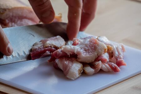 Garlic and bacon.Bacon and garlic. Bacon and garlic on a table on a blackboard. Food photography.の写真素材