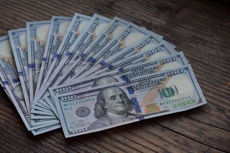 dollars background. Dollars background. Background of different us dollar banknotes. Finance concept.の写真素材