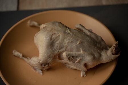 dietary meat. Linen background. Quail cooked on a plate. Healthy food, boiled meat