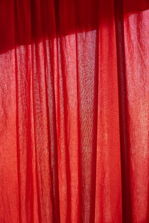 red paint background. Red fabric background. red fabric texture closeup, useful for background. red silk cotton background,fabric cloth textureの写真素材
