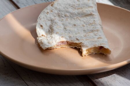 Pita, pitta bread with sausage. Pita with cheese and sausage. Food photographyの写真素材