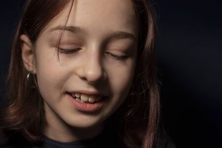 portrait of a little girl. Girl 9 years old. Representatives of the Alpha generation are much less affected by formal rules. It is important for them not to be in the system, but in the stream.の写真素材