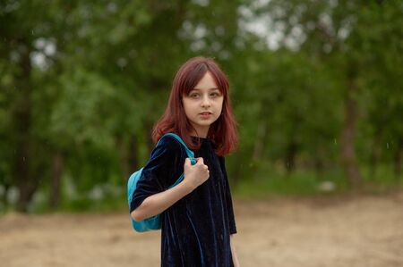 portrait of a little girl. Girl 9 years old. Representatives of the Alpha generation are much less affected by formal rules. It is important for them not to be in the system, but in the stream.の写真素材