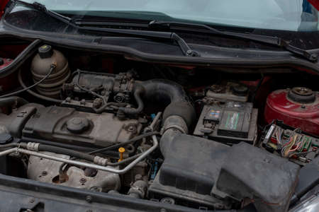 red car with opened hood. Red car hood open. Auto repairの写真素材
