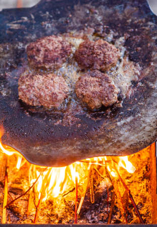 Burger Grilling on Fire. Homemade Hamburgers. Grill Meatballs. Making Hamburgers on a Grill Outdoor....
