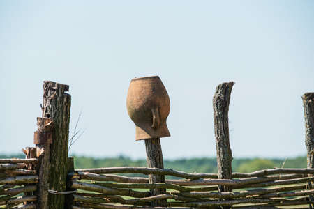 Fence wicker from the vine, texture, background. Wicker vine fence. woven vines texture embossed background. Organic woven willow wicker fence panel suitable for crafts, picnic or gardening backgroundの写真素材