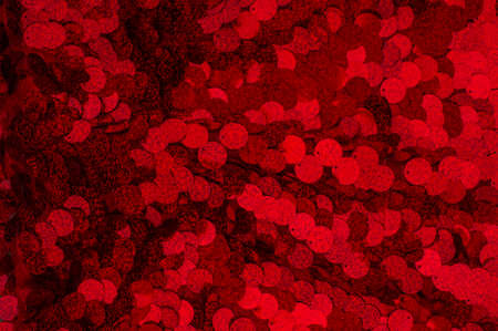 Red Sparkling Lights Festive background with texture. Abstract Christmas twinkled bright bokeh....