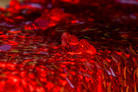 Red sequins pattern. Sparkling sequins background. Red sequin fabric for background. rectangular red shiny fabric with sequins, Christmas background. Sequins on Fabric, red Beads. Fashion Fabricの写真素材