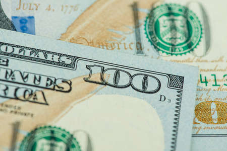 One hundred dollars pile as background. A background from many hundred dollar banknotesの写真素材