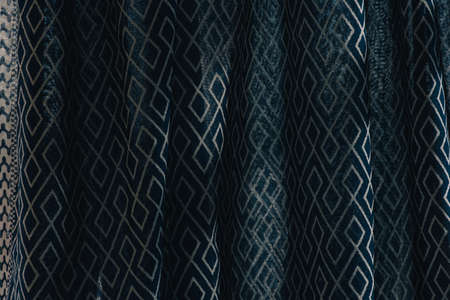 material textile background. Blue fabric in diamonds. Close-up of the white blue diamond shaped...