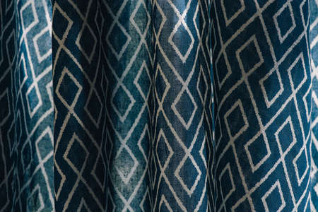 material textile background. Blue fabric in diamonds. Close-up of the white blue diamond shaped fabric textile texture, background. High-quality macro photography.の写真素材