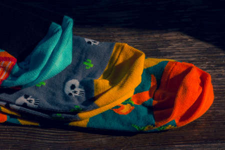 Socks colorful. Set of socks. On wood background. Hey Lesia,