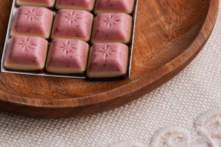 White Chocolate with Mixed Berry bar. Pink white brown chocolate layers. Dessert sweets chocolate